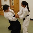 Men can generate a greater degree of power but women tend to catch on to Aikido techniques more rapidly than men.  This is because they can not rely on upper body strength.  They must rely on the generation of power through ki extension.  